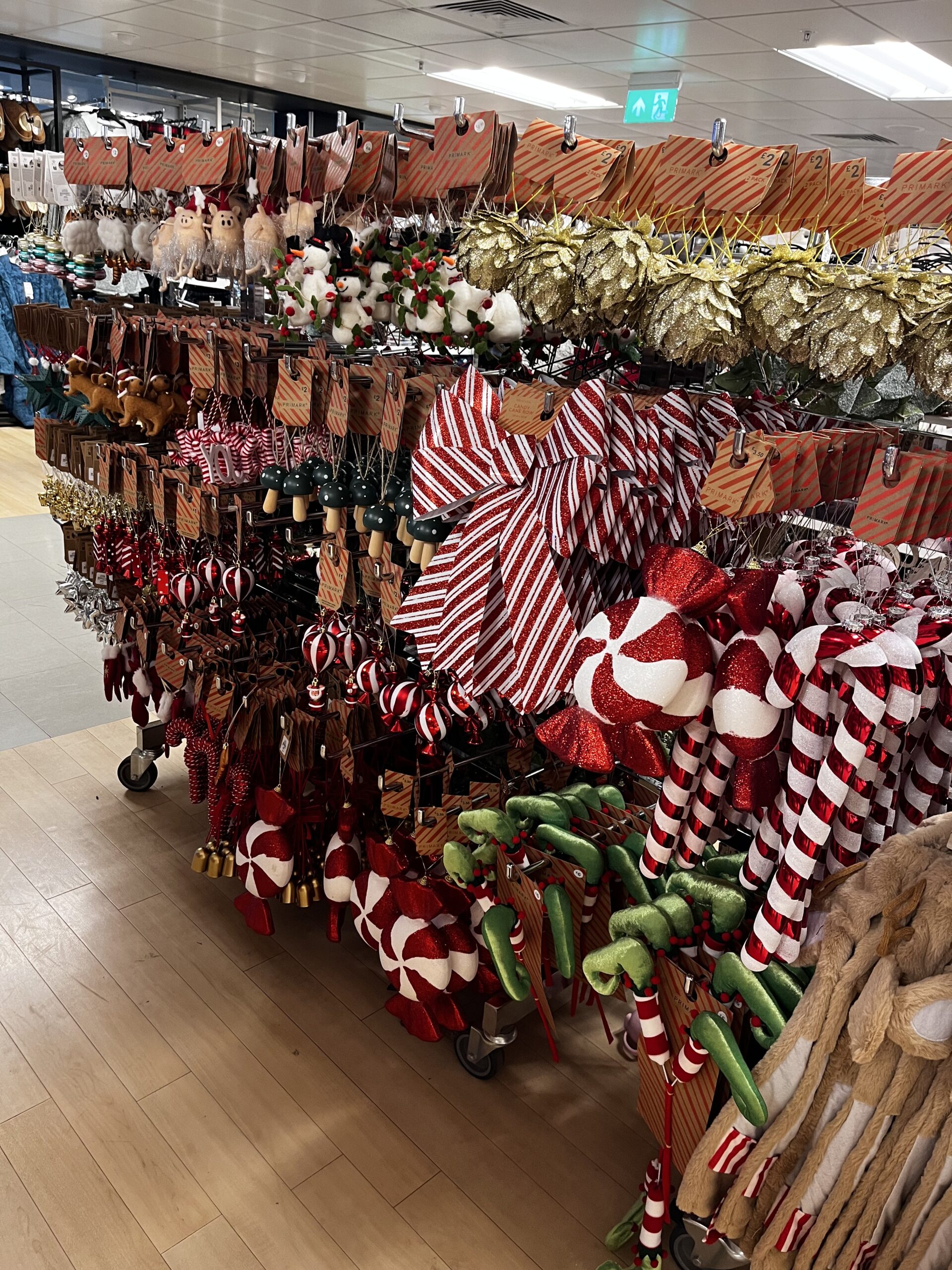 Christmas decoration selection at Primark. Featuring red and white sweets, baubles and bow